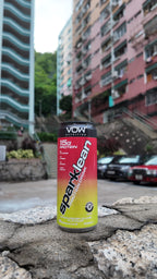 Sparklean Strawberry and Lime with Hong Kong residential buildings and a street behind it